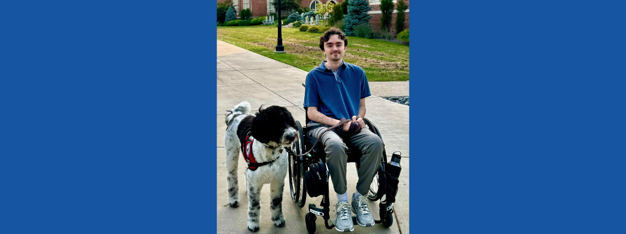 Steph with his service dog, Noel