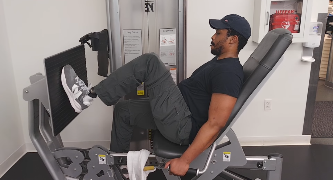 DeMarcus doing leg press exercise