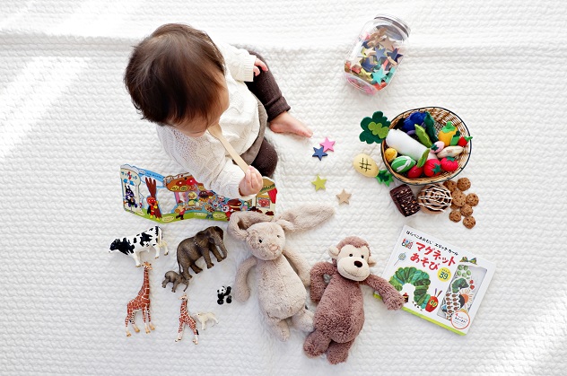 baby playing with toys - Unsplash free image