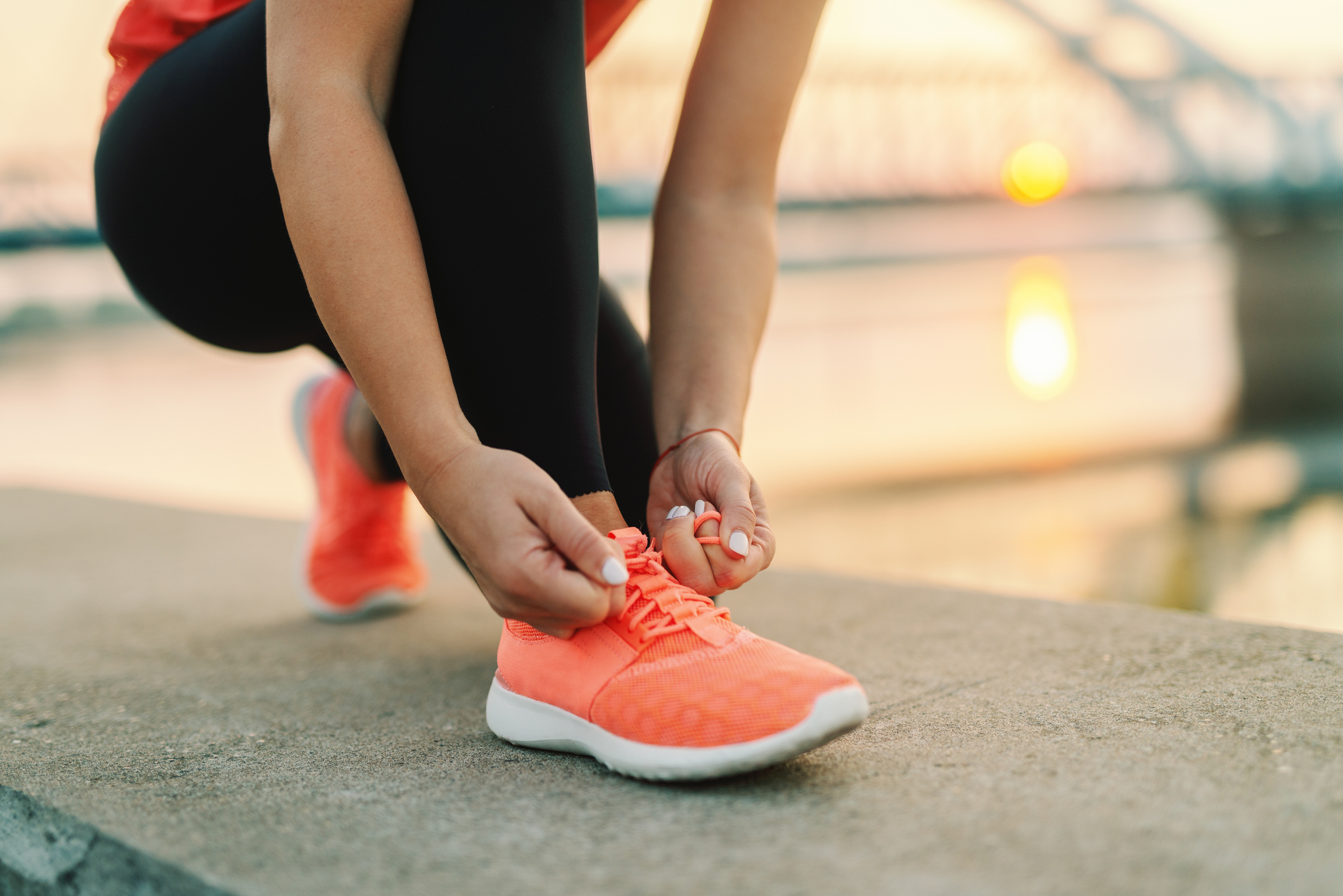 A person tying their shoe