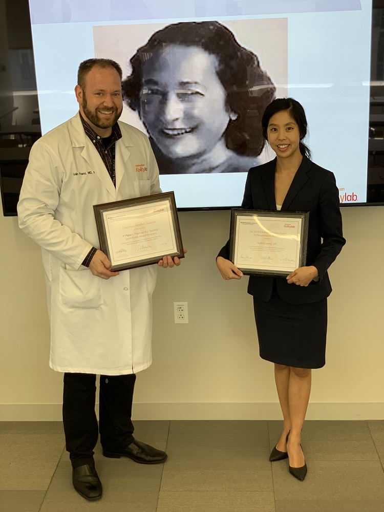 Dr. Franz and Dr. Leung stand with their awards. 