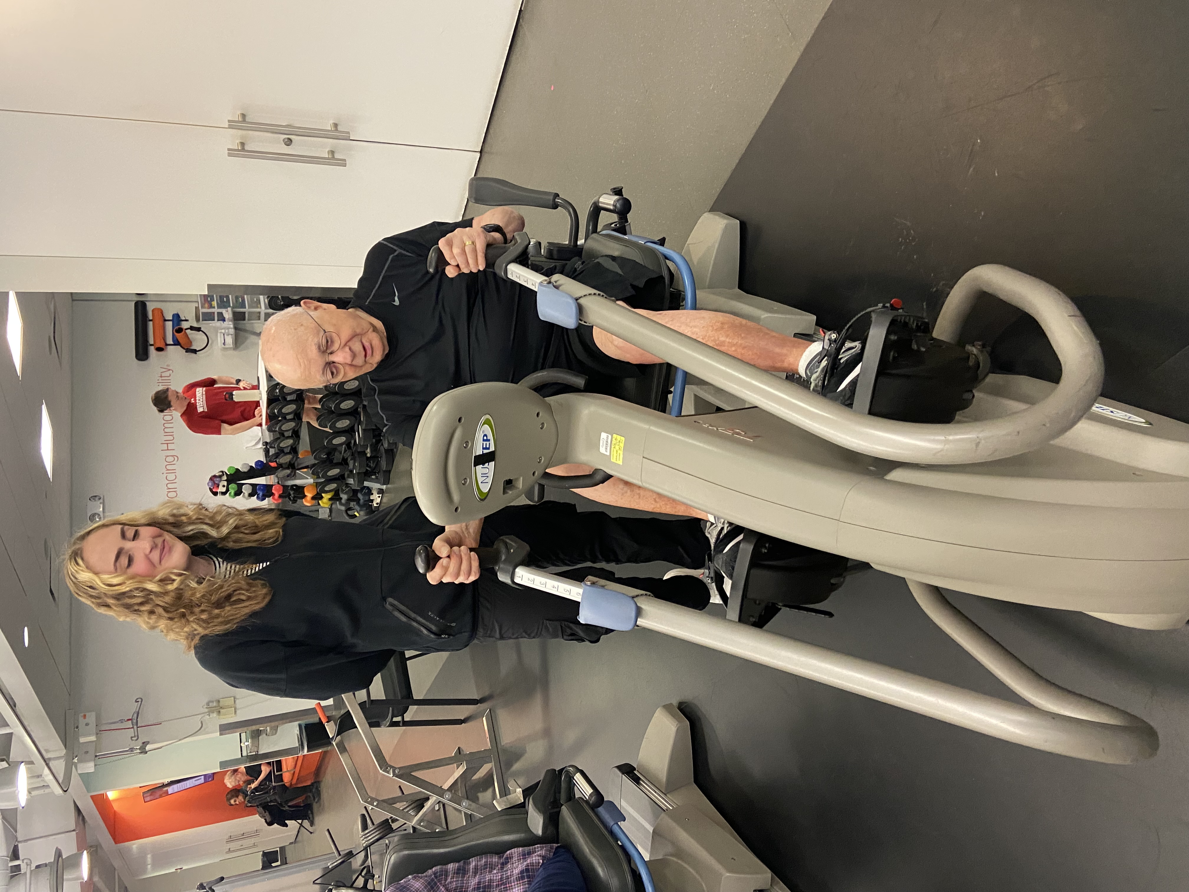 person on exercise bike