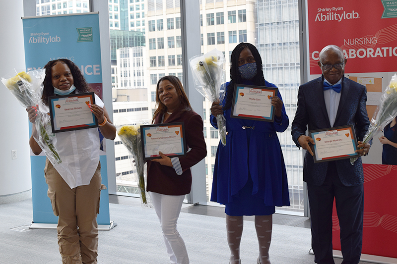 From left: Bebe Bickart, Rosmery Soriano-Moore, Phyllis Cain and George Mbahotu. Note: Latrice Jones was unable to attend the March 25 ceremony.