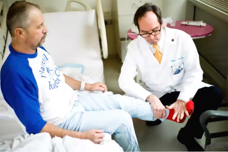 Dr. Harvey treating a patient