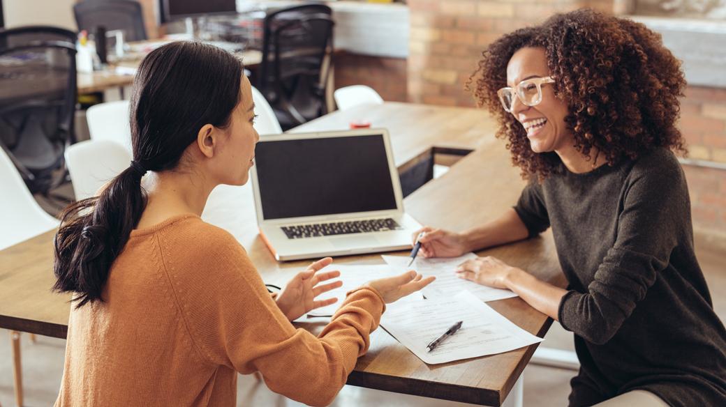 two women collaborating