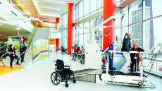 Patient participates in physical therapy on a treadmill.