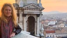 Kayla Jones poses in front of an Italian vista.
