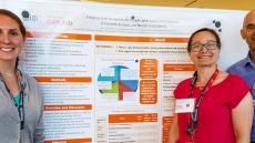 Left to right: Laura Stoff, Dr. Miriam Rafferty and Dr. Allen Heinemann pose in front of a research poster.