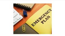 photo of folders on a desk. Yellow folder says Emergency Plan