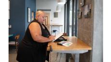 photo of a black woman at a standing desk