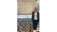 photo of Nicole Sharf in front of her poster at the 2024 Rehab Psych meeting