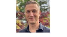 a photo of Mark Harniss, a white middle-aged man with short brown hair