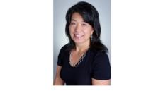 Color photo of Shu Cole, a middle-aged Asian woman with black hair and a black top