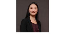 color photo of Amy Zhou, a young woman of Chinese descent with long black hair wearing a black top