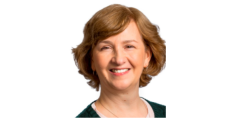 color photo of Anne Deutsch, a middle aged white woman with short blonde hair wearing a black top.