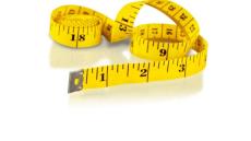 a color photograph of a yellow tape measure