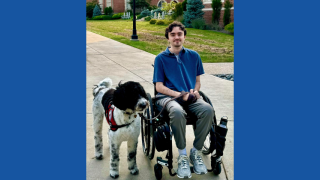 Steph with his service dog, Noel