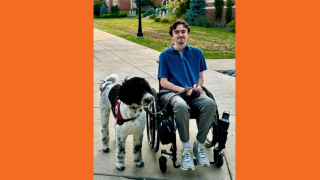 Steph with his service dog, Noel
