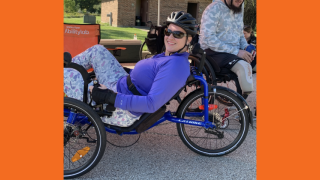 Molly riding a recumbent bike