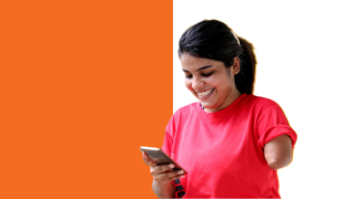 Woman with left arm amputation above the elbow looking at smartphone in right hand