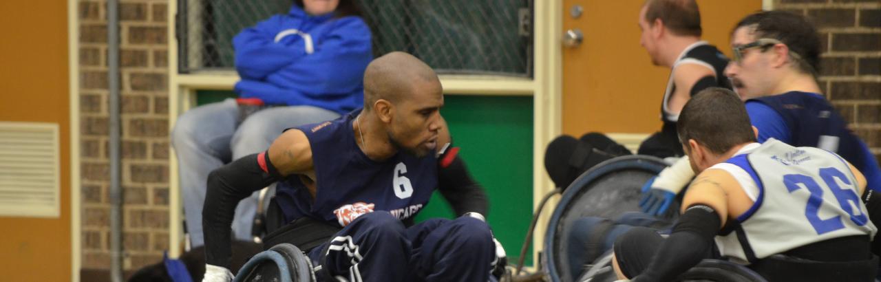 Wheelchair rugby players go for the ball