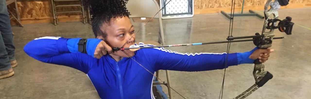 Deborah participates in adaptive archery 