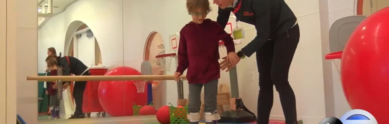 child with CP interacts with therapist at Shirley Ryan AbilityLab