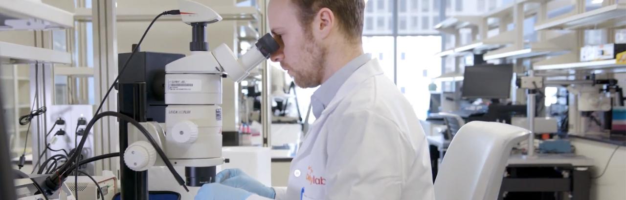 Man in lab coat in biologics lab