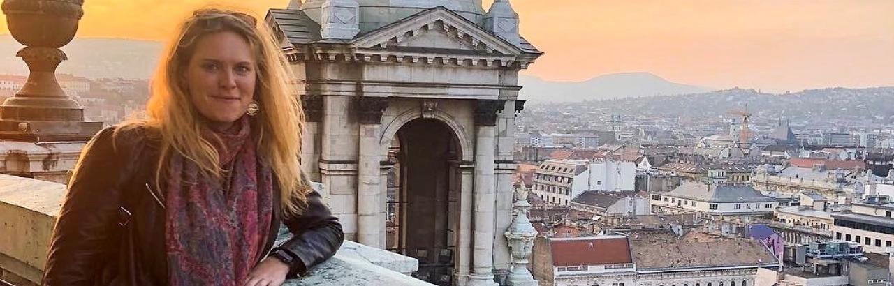 Kayla Jones poses in front of an Italian vista.