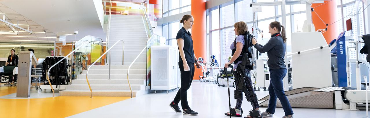 Therapists Work with Patient on Walking