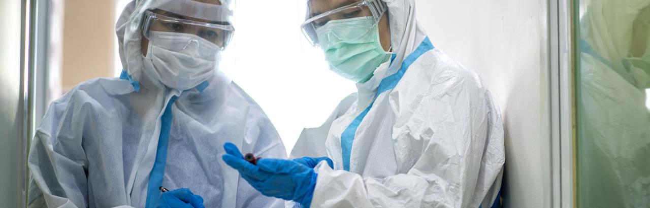 Two healthcare workers in PPE