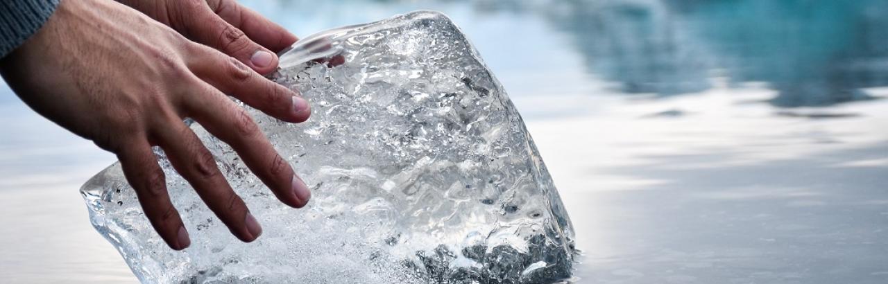 hands on ice chunk