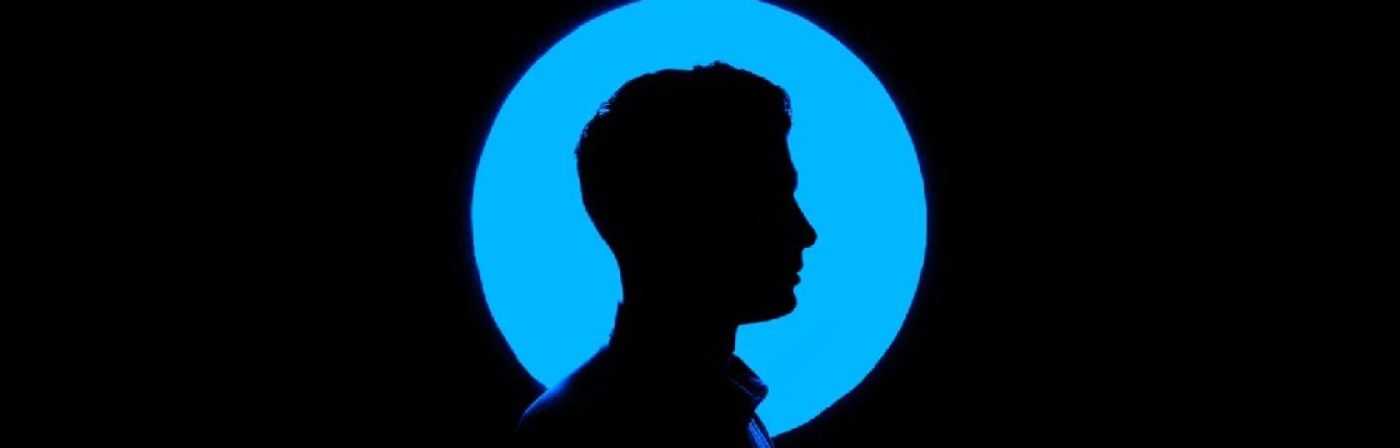 black background with cameo portrait with blue circle