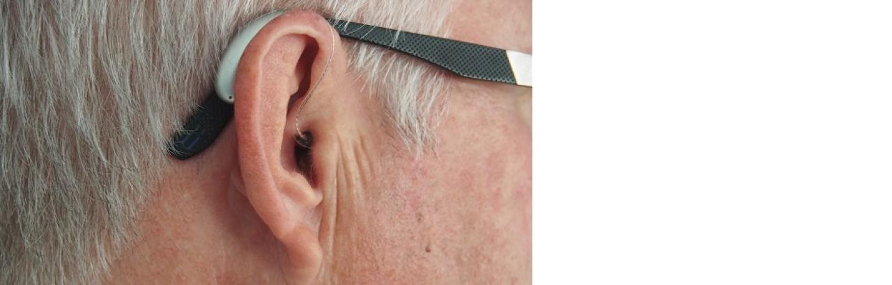 ear and hearing aid with glasses 