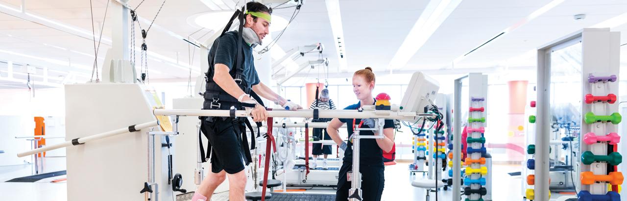 Patient at Shirley Ryan AbilityLab doing rehabilitation with their care team