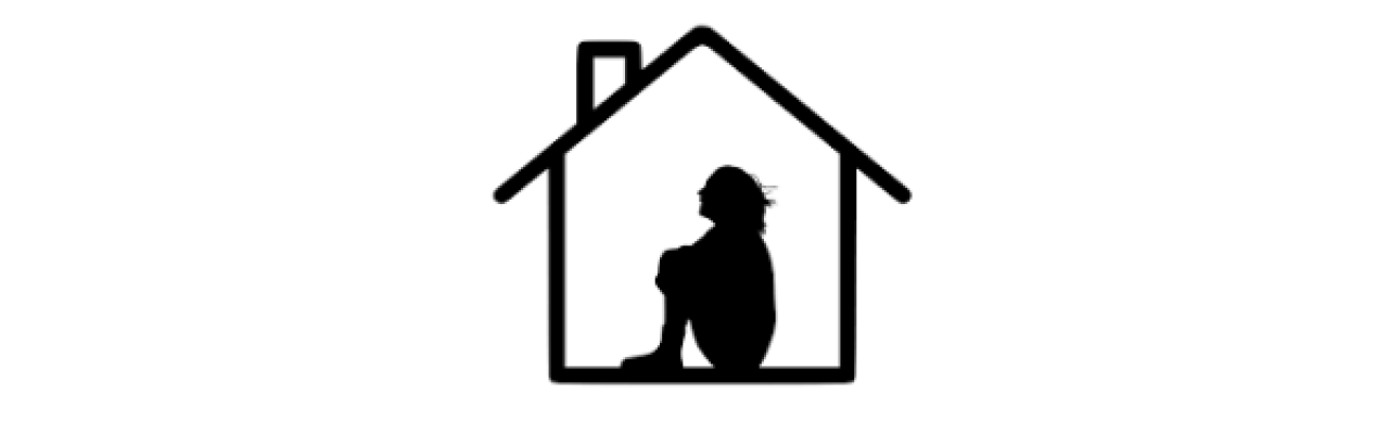 This is a silhouette of a person sitting on the floor alone in their home.
