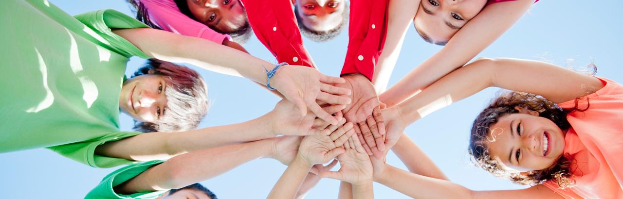 Kids hands in a circle