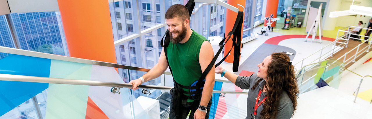 spinal cord injury patient on AbilityLab stairs