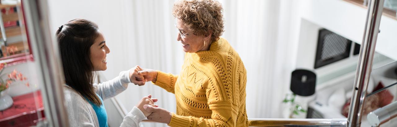 patient and caregiver on stairs