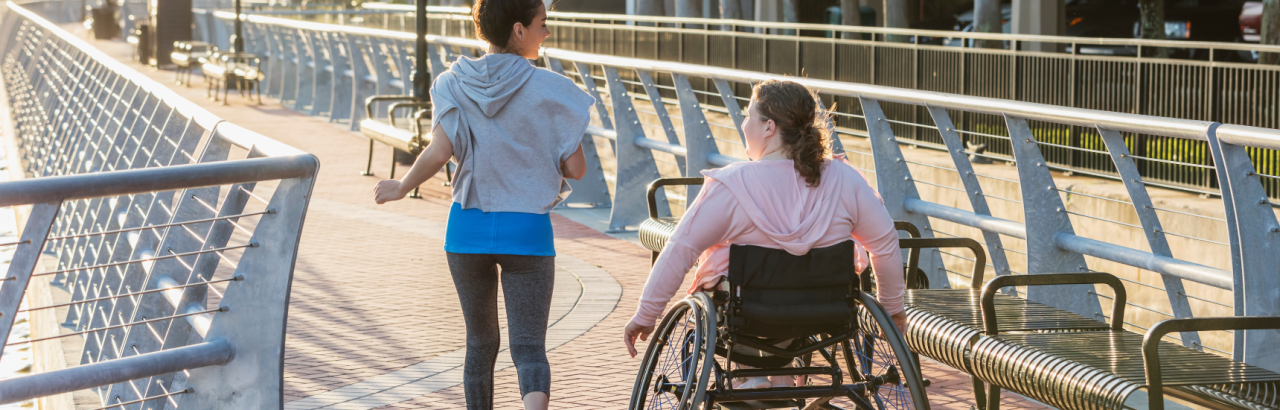 Wheelchair user exercising with their friend 