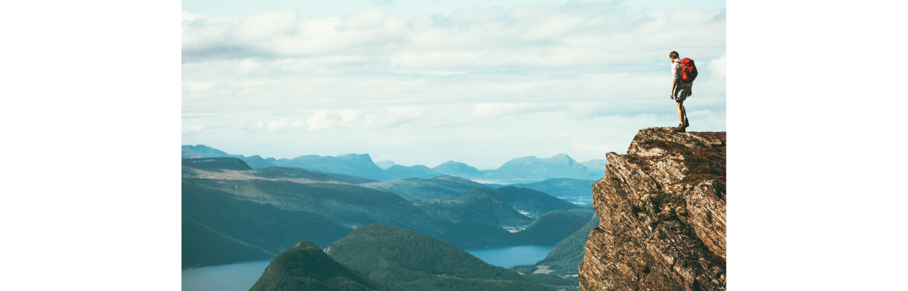 Person standing at edge of cliff