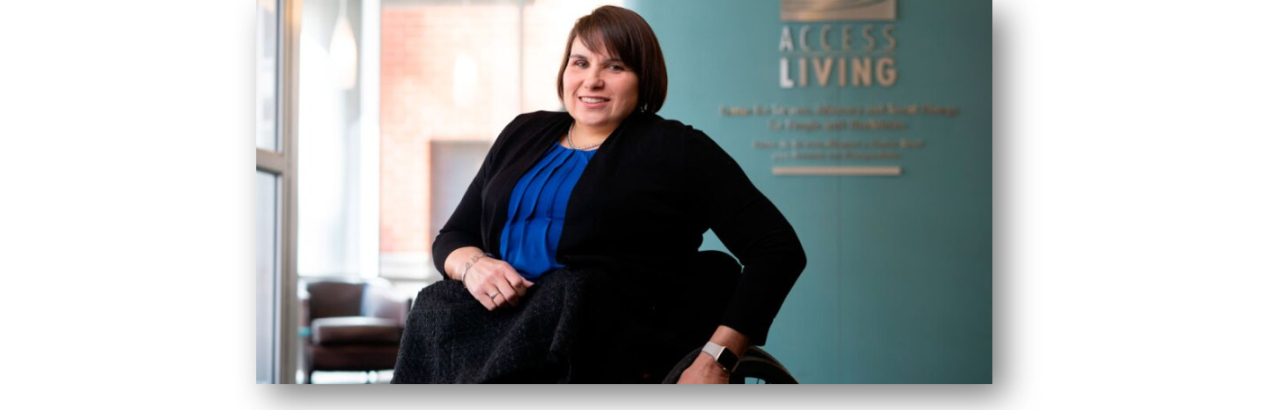 Picture of Karen Tamley, a white woman with brown hair sitting in a wheelchair.