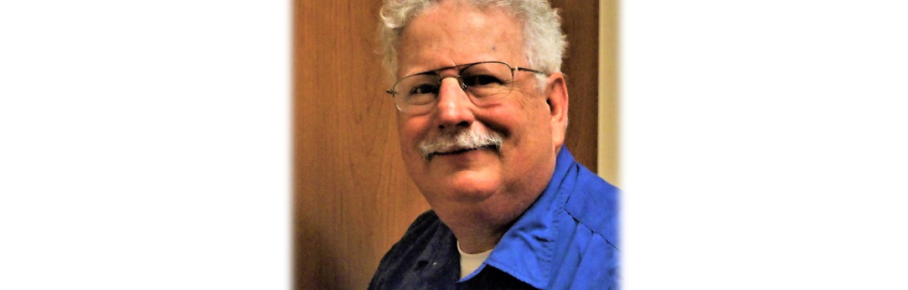 Robert Trierweiler- white man with white curly hair and glasses