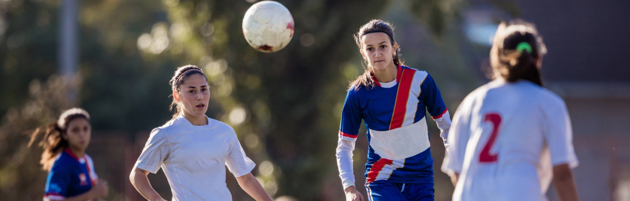 Women playing soccer