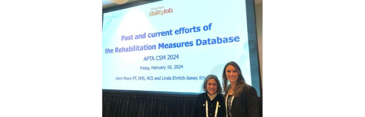 Linda Ehrlich-Jones and Jenni Moore in front of their slide presentation on the RMD at the APTA CSM meeting