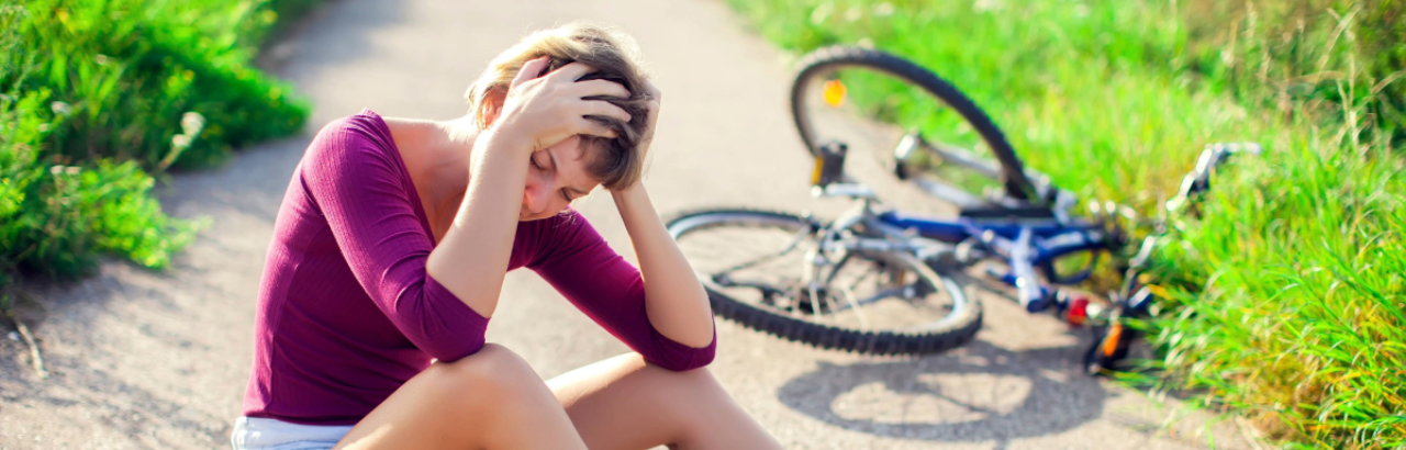 Woman falling off bike