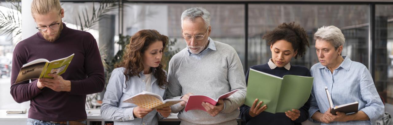 Adult literacy group reading books