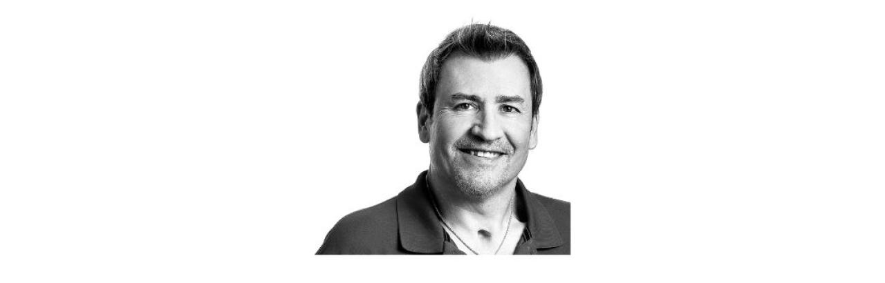 Black and white photo of Nick Formanski, a middle aged white man with short dark hair