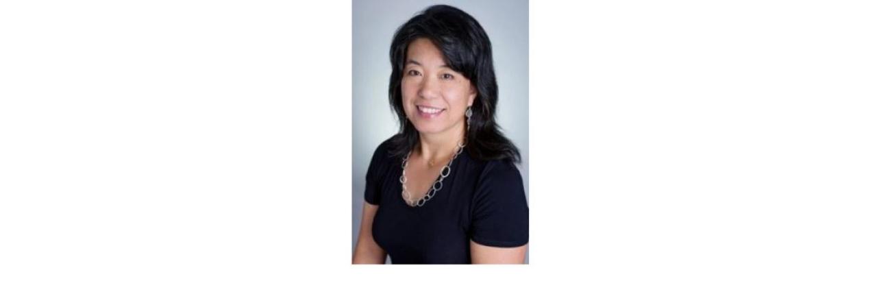 Color photo of Shu Cole, a middle-aged Asian woman with black hair and a black top
