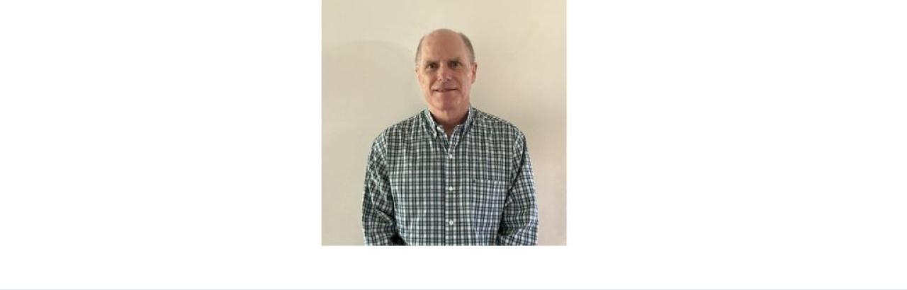 Color photo of Kevin Fearn, a middle aged white mad in a checkered shirt